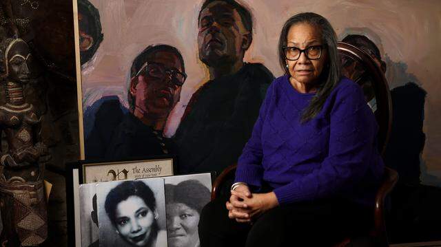 Judge Maryellen Hicks is photographed in front of a painting by Sedrick Huckaby and photographs of her ancestors on Monday, Feb. 23, 2026. The Black Women Lawyers' Association of Tarrant County plans to rename its organization in her honor.